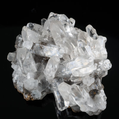 Calcite, lustrous transparent crystals to 25 mm in 85 mm group. Bigrigg Mine, Egremont, West Cumbria, England.