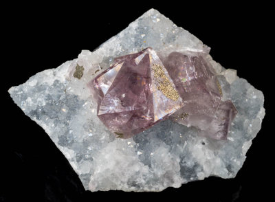 Lustrous gemmy penetration twinned fluorite, 35 mm on 11 cm matrix. Rotherhope Fell Mine, Tynebottom Flats, Alston Moor, Cumbria