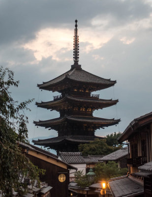 Kyoto pagoda above rooftops at dusk. Yasaka no To