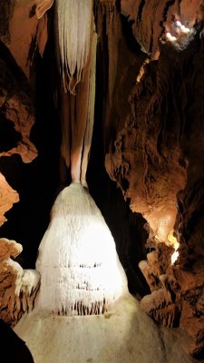 Huge stalagmite growing in the dark