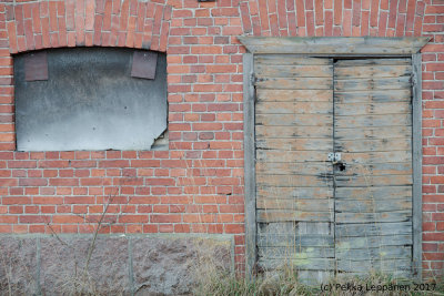 Old barn door with a window