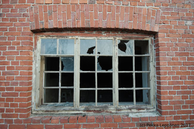 Old barn window with most of the glass gone