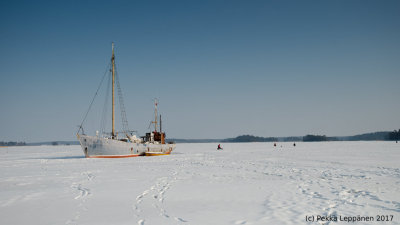 Ice fishing by the rusting ship, one year later