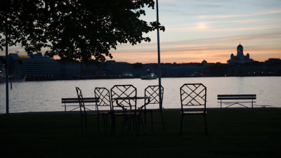 Helsin skyline at dawn / vacant chairs