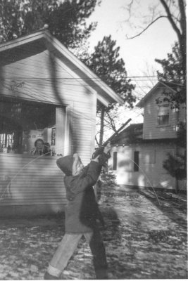 1957 - Shooting my BB gun at the lake house