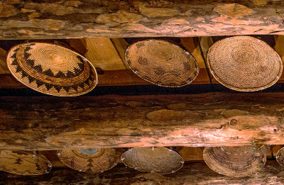 Baskets between Ponderosa logs of John Hubbell's living room ceiling, Ganado, AZ