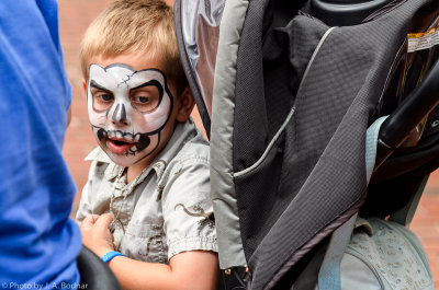 Child contemplating at a summer festival in PA