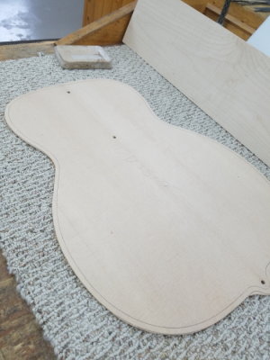 Top cut out with location holes and sound hole located.