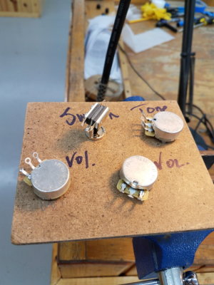 Switch, tone and volume pots attached to soldering board
