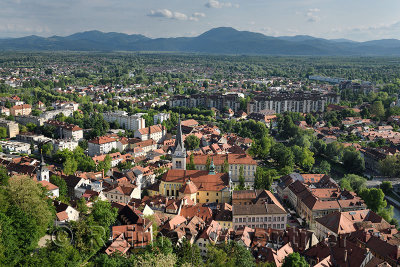 Ljubljana capital city of Slovenia with the Karawanks Alps foothills former marsh land and St James's Catholic church from Ljubl