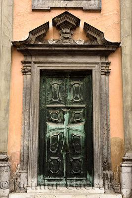 Bronze Front door with Maltese cross at Krizanke Church of Our Lady of Mercy by Order of Teutonic Knights of the Cross church Lj