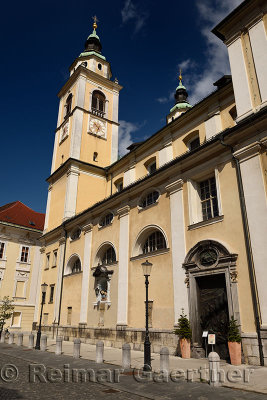 South side of St. Nicholas Catholic church Ljubljana Cathedral with belfry, gothic pieta, door on Cyril Methodius Square Ljublja