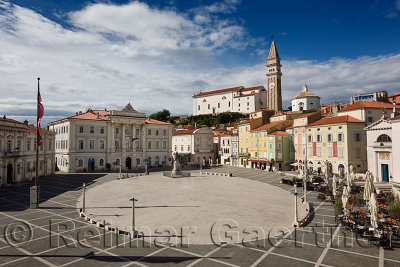 Tartini Square in Piran Slovenia with Courthouse, City Hall, Tartini statue, St. Georges Parish Church with baptistry, and St P