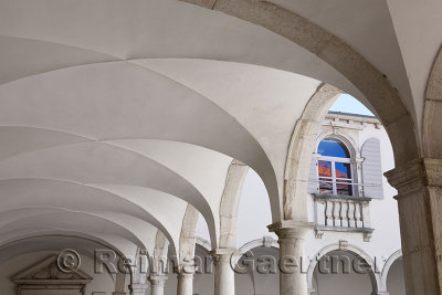 Half arched portal of the Minorite Monastery cloister attached to the Church of St Francis of Assisi in Piran Slovenia with wind