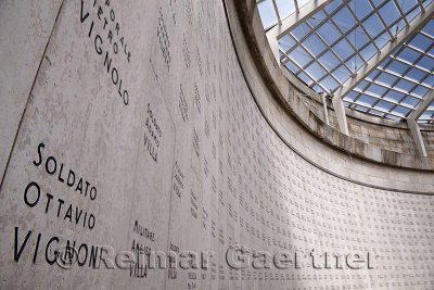 Close up of a soldiers name in the central tower with skylight of the interred dead at the World War I memorial in Oslavia Italy