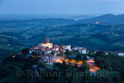 Medieval hilltop village of Smartno Brda Slovenia at dusk in the Gorizia Hills with Saint Martin church, Medana village and Ital