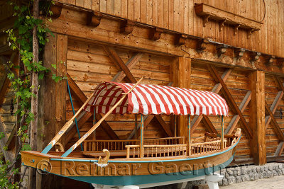 Newly hand crafted traditional wood Pletna boat outside woodworking shop in Mlino village for unique use on Lake Bled Slovenia