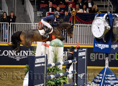 Kent Farrington on Voyeur soaring to a first place win at the Longines FEI World Cup Show Jumping competition jump off at the Ro