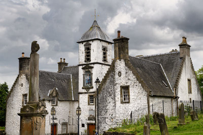 Monument and tomb of Rev Ebenezer Erskine and other gravestones at Stirling Youth Hostel with Old Town Jail in Stirling Scotland