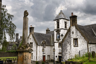 17th Century Burgh architecture of Cowanes Hospital with statue of John Cowane at Holy Rude Old Town cemetery and Stirling Jail 