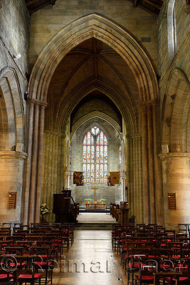 Apse with stained glass window and Nave interior of the medieval historic Church of the Holy Rude in Stirling Scotland UK