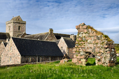 Medieval pink granite stone ruins of the Bishop's House next to the museum at Iona Abbey monastery on Isle of Iona Inner Hebride