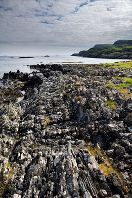 Flipped sedimentary rock layers at Sandeels Bay Atlantic Ocean at Isle of Iona Inner Hebrides Scotland UK