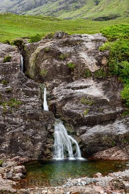 Falls of Glencoe waterfall at the Meeting of Three waters at the foot of Three Sisters mountains of Glen Coe Scottish Highlands 