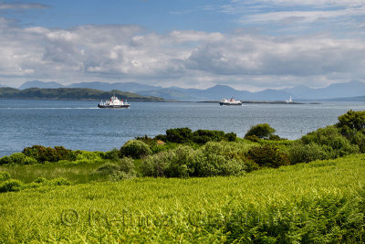 Sound of Mull Ferries at Loch Linnhe with Lismore Lighthouse and Ben Cruachan mountains from Duart Castle bracken Scotland UK