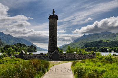 Glenfinnan Monument to the Jacobite uprising with mountains around Loch Schiel in Lochaber Scottish highlands Scotland United Ki