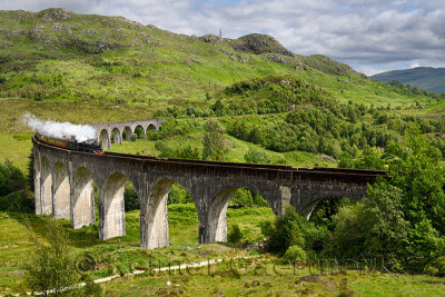 Heritage Jacobite coal fired Steam Train at Glenfinnan viaduct in the Lochaber Scottish Highlands Scotland United Kingdom