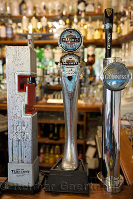 Taps for cold Tennents and Guinness beers and Magners Cider at Taigh Ailean Hotel bar Isle of Skye Scotland UK