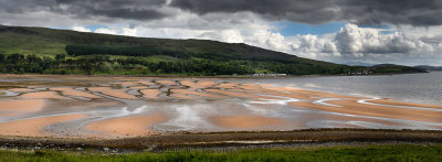 Panorama of patterns of red sand at low tide on Applecross Bay of Inner Sound of the Scottish Highland Mainland Scotland UK