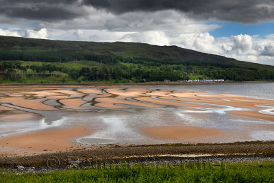 Patterns of red sand at low tide on Applecross Bay of Inner Sound of the Scottish Highland Mainland Scotland UK