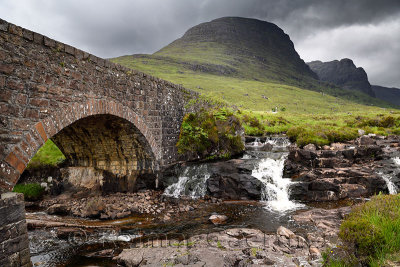 Stone bridge over Russel Burn mountain stream of Bealach na Ba road mountain pass on Applecross Peninsula Scottish Highlands Sco