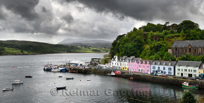 Colorful houses on Quay street of Portree Harbour on the Isle of Skye Inner Hebrides Scottish Highlands Scotland with boats and 