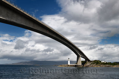 Skye Bridge over Kyle Akin Channel of Inner Sound to Loch Alsh and Eilean Ban Island with white Kyleakin lighthouse and cottages