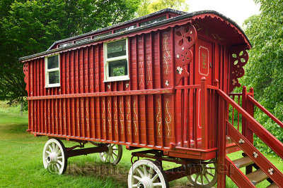 Red painted Gypsy Traveler Caravan parked at Cawdor Castle grounds Nairn Scotland UK