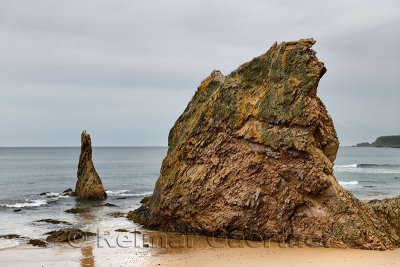 Three Kings red quartzite sea stacks on Cullen Bay beach on the North Sea Moray Scotland UK