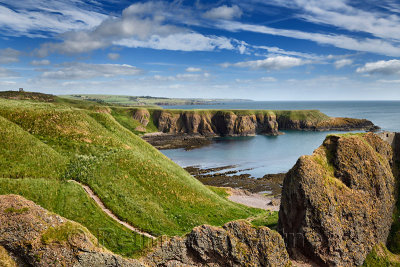 Stonehaven War Memorial on Black Hill with Castle Haven Bay and steps down to the Donnottar Castle ruins entrance Scotland UK