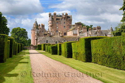 Red stone path with yew hedges in east Italian Garden of Glamis Castle home of Earl and Countess of Strathmore and Kinghorne Sco
