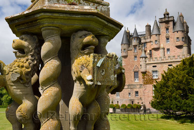 Close up of damaged Lion sculptures of The Great Sundial on the front lawn of Glamis Castle Scotland UK