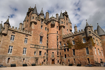 Red stone of the front of Glamis Castle home of the Earl and Countess of Strathmore and Kinghorne Scotland UK