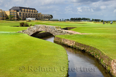Swilken Bridge over Swilcan Burn on the 18th Hole of the Old Course at St Andrews Links golf course the oldest in the world in S
