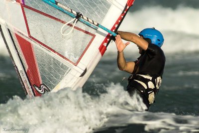 Wind surfer and the sign of the Hand