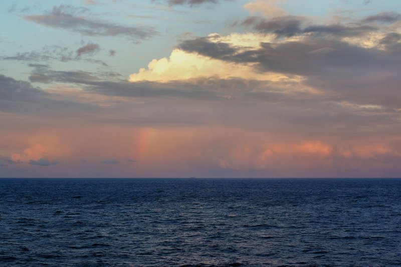Rainbow, sunset, and ship