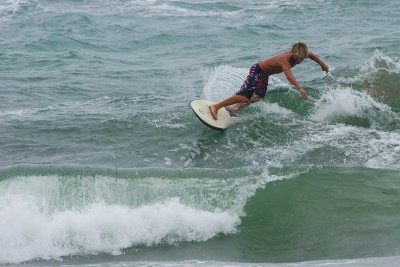 Boca beach surfers on a windy day