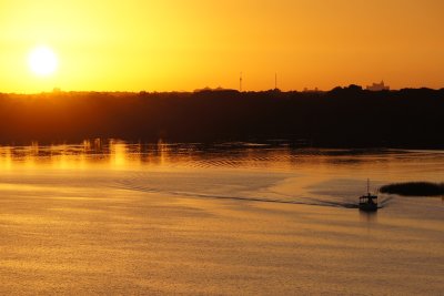 Boat and rising sun