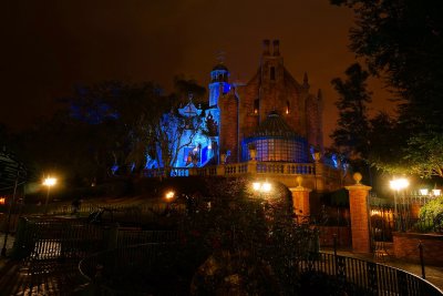 Haunted mansion at night in the rain