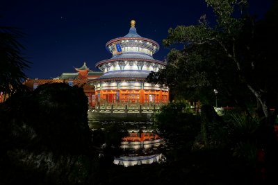 China temple and reflective pool at night